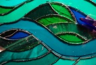 Peacock; close up of cut feather pieces on paper