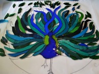 Peacock cutting glass pieces to the cartoon